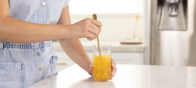 skin care benefits of collagen In-Article Image 03 person mixing collagen drink