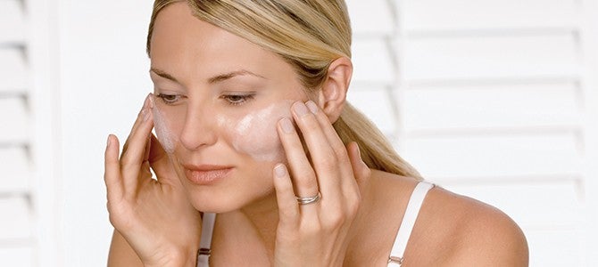 LumiSpa-180 article - image 03 woman applying face wash