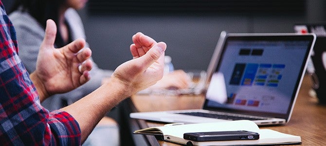 Mentorship Image 03 man speaking with his hands during a meeting - photo by Headway on Unsplash