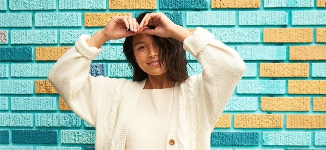 New Year Banner smiling girl in front of brick wall